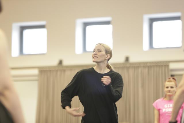 A woman in a dance rehearsal room 