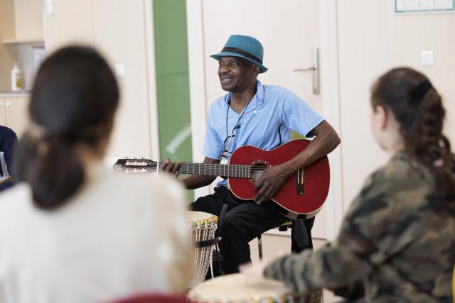 A man who plays the guitar