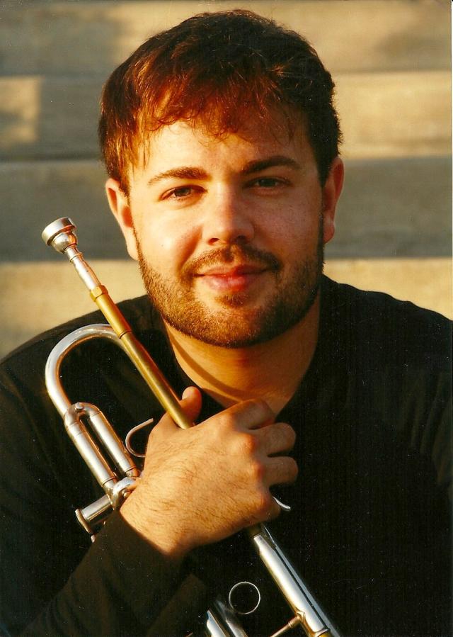 a man holding a trumpet