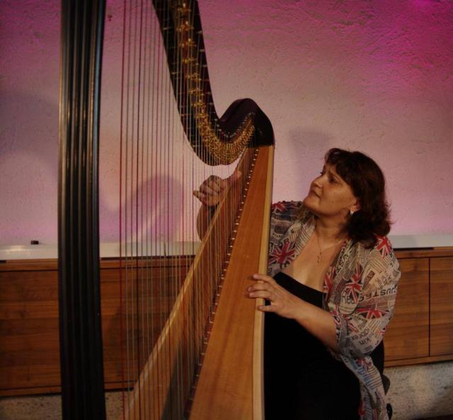 A woman playing the harp